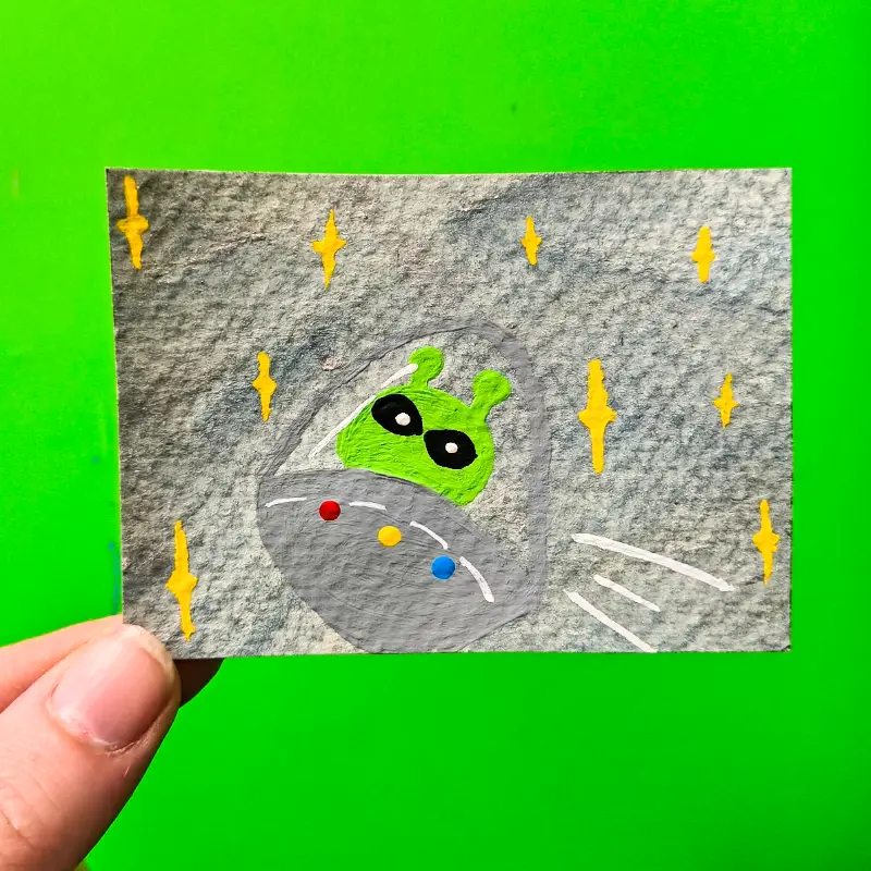 Alien flying through Space and Stars aceo art card
