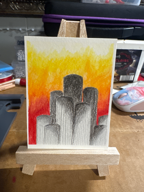 A circular cement city aceo art card